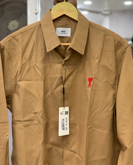 AM I BEIGE SHIRT WITH RED LOGO